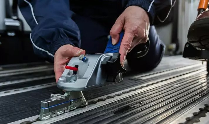 healthcare assistant securing a wheelchair